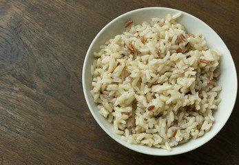 A Cooked  Jasmine Rice , Brown Rice in bowl  on wood table.