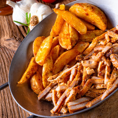Rustic gyros plate it green salad and potato wedges
