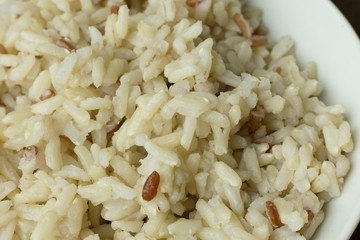 A Cooked  Jasmine Rice , Brown Rice in bowl  on wood table.