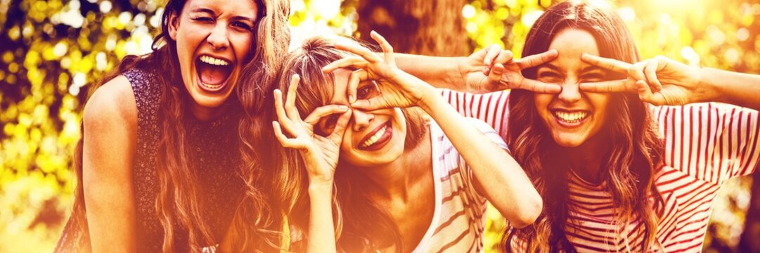 Portrait Of Happy Friends Taking Selfie