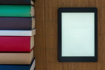 An ebook with the white screen surrounded by books