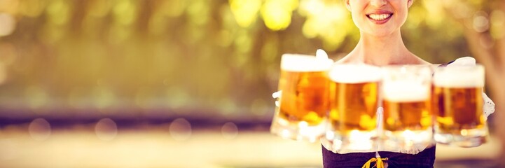 Pretty oktoberfest blonde holding beers