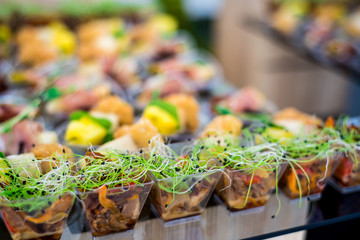 Tasty snacks with cheese and fish on the buffet table