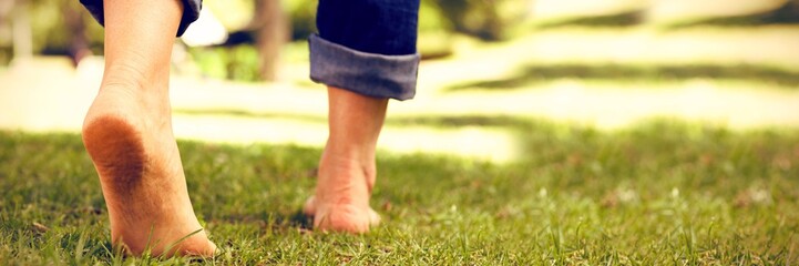 Woman walking on grass