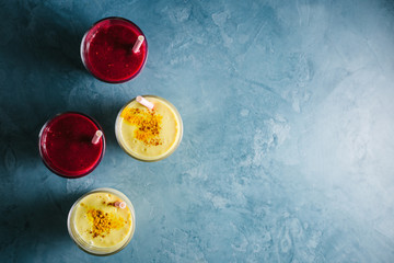 Obraz na płótnie Canvas Golden yogurt milk with turmeric and red smoothie