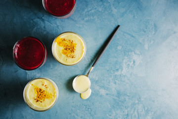 Golden yogurt milk with turmeric and red smoothie