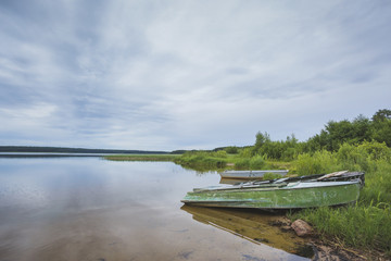 Boats on the shore of Lake Beloe. Russia