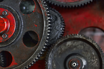 Metal gears on a red background