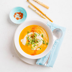 Pumpkin creamy soup in bowl