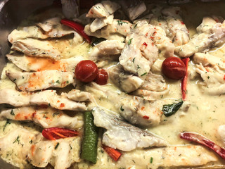 Pieces of fish in white sauce