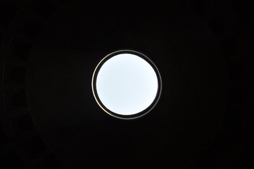 Light is coming in from a dome in an ancient Italian building