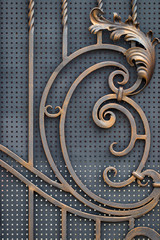 ornate wrought-iron elements of metal gate decoration