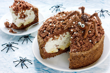 Halloween spider nest cake with chocolate and whipped cream banana filling