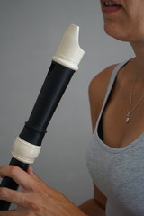 Fototapeta premium Woman playing tenor recorder