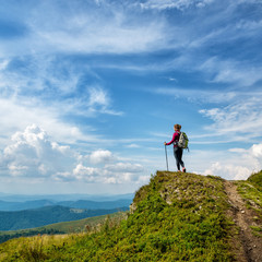 Young woman hiking in the mountains