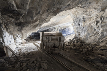 Mining trolley in a tunnel of an abandoned lime mine in Switzerland - 215060251