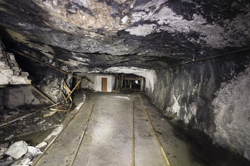 Railway tracks in a tunnel of an abandoned lime mine in Switzerland