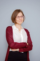 Portrait of a confindent business woman on grey background