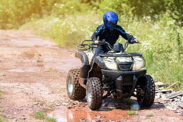 A trip on the ATV on the red road.