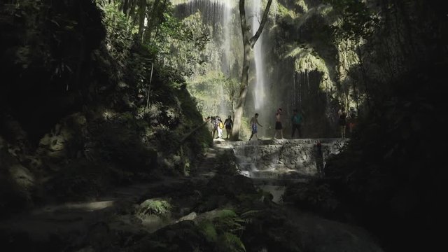People exploring Tumalog Falls.
