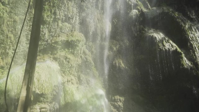 People bathing in Tumalog Falls Philippines.