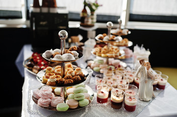 Fototapeta na wymiar Close-up photo of delicious desserts on the wedding buffet.