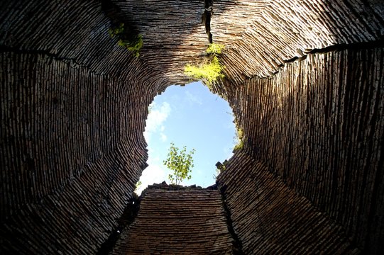 Brick structure with sky view inside Prasat Yeay Peau Sambor Prei Kuk near Kompong Thom Cambodia