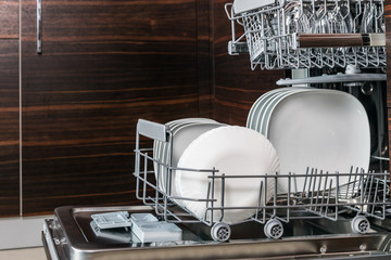 clean dishes, sides and Cutlery in the dishwasher. work on cleaning the house