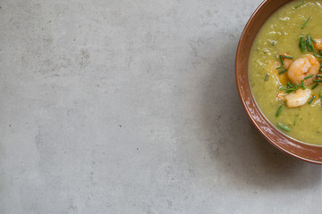 home made green soup with grilled shrimps