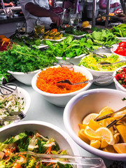 Dishes of fresh vegetables and herbs, greens