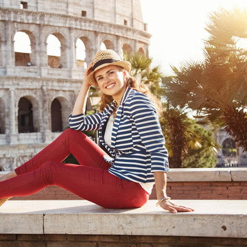 smiling stylish traveller woman in Rome, Italy