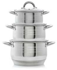 Set of three metal pans, stack of pans on a white background © kseyale