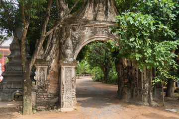 arch of stone in the nature in a buddhist temple in cambodia