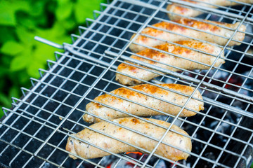 Grilled sausages in the backyard. Selective focus.