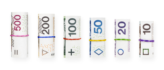 Rolled with a rubber polish zloty banknotes isolated on white background with clipping path