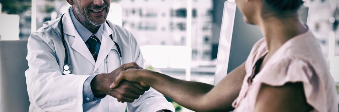 Doctor Shaking Hands To Patient