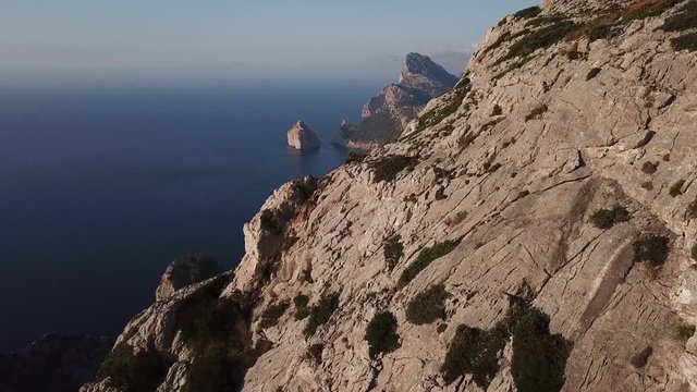 Coast with mountains and rocks of Cape Formentor, aerial view from drone