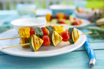 Delicious grilled skewers of colorful vegetables.
