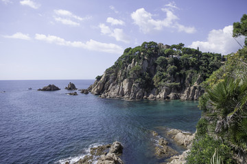 Fototapeta na wymiar View of the sea with coastal rocks. Peaceful lagoon.