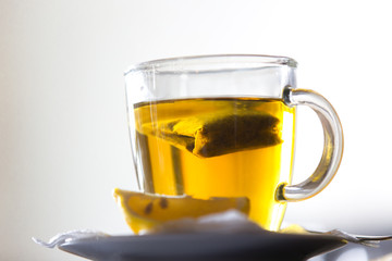 Tea glass cup with tea bag and lemon
