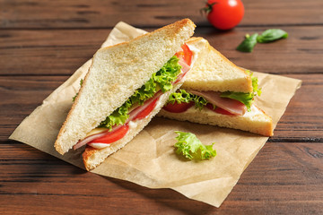 Tasty toast sandwiches on table. Wheat bread