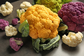Colorful cauliflower cabbages on table. Healthy food