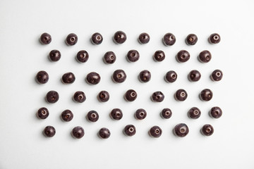 Fresh acai berries on white background