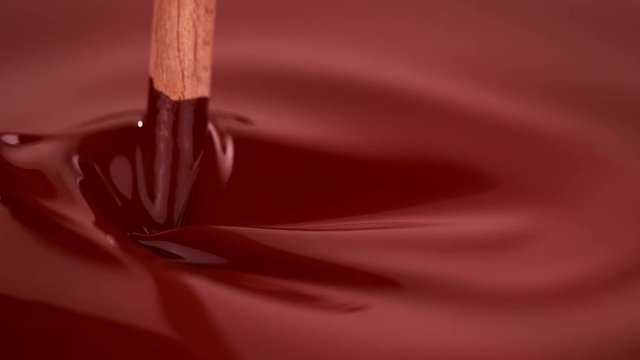 Super slow motion of stiring hot chocolate. Filmed with cinema high speed camera