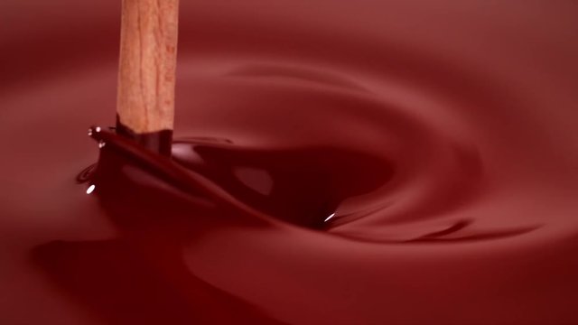 Super slow motion of stiring hot chocolate. Filmed with cinema high speed camera