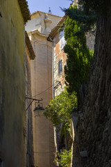 Fototapeta na wymiar narrow lane of village Gordes, Provence, member of Les Plus Beaux Villages de France, most beautiful villages of France, massif of Luberon