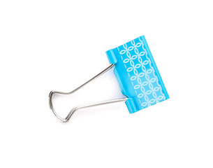 Blue binder clip on white background. Stationery for school