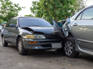 Car crash accident on street with wreck and damaged automobiles. Accident caused by negligence And...