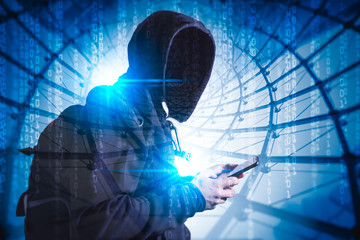 The abstract image of the hacker using a smartphone behind binary code and the cityscape is backdrop. the concept of cyber attack, virus, malware, illegally and cyber security.