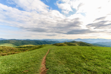 Fototapeta na wymiar Dirt path along green hillside in North Carolina